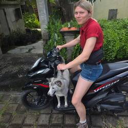 Having a go at riding the motorbike for 5 metres with a blind passenger