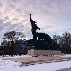 Strong woman. Men following.