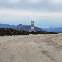 Lighthouse down the beach