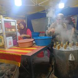 bamboo pulu (steamed rice flour dessert, served with coconut)