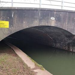 Rectangular entrance and an arched exit