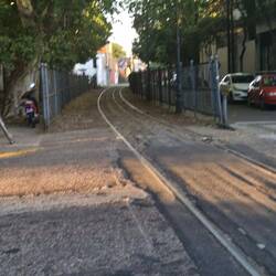 The train runs right next to the houses