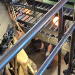 A young lad shoveling coal into the engine. The ship burns one tone of coal an hour.