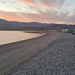 Long beach with people pretty spreadbout