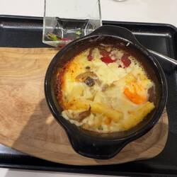 My half eaten shrimp and mushroom pasta at the Sakura First Class Lounge.