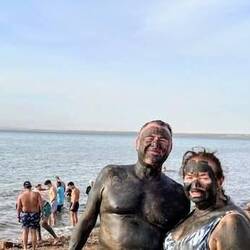 Basking in the mud before heading back for a float in the Dead Sea
