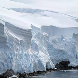 This is ~100-200 ft of snow. The blue color really looks like that, it's super compressed ice.
