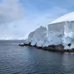 Video gives a better sense of scale, look close and you can see birds flying by the rocks at first