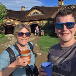 Enjoying our complimentary drink in front of the blue dragon pub