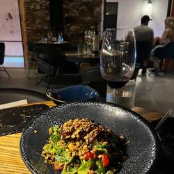 Green salad with grains, Parmesan cheese, pear, and walnuts