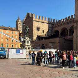 A group of students learning about the maintenance work at the Neptune Fountain — Bologna, Italy.