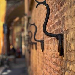 Historic iron rings that were once used to tether animals ... such as horses — Bologna, Italy.