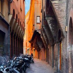 Old architecture and modern conveyances — Bologna, Italy.