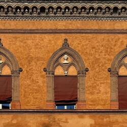 These red shades are a requirement for all the historic buildings ... Piazza Santo Stefano — Bologna