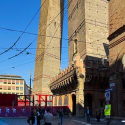 The pronounced lean of Garisenda Tower is very apparent from this angle — Bologna, Italy.