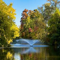 Fall colors and reflections on a beautiful fall day at Giardini Margherita — Bologna, Italy.