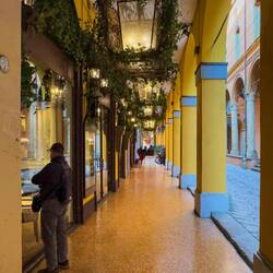Another Bolognese portico ... this one with oversized lanterns — Bologna, Italy.