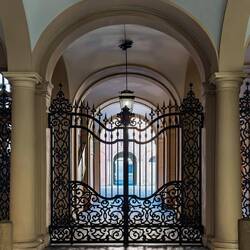 A fancy gate into a private courtyard — Bologna, Italy.