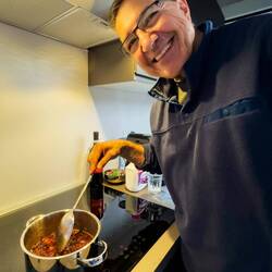 Mui making jam with some persimmons that were about to go bad — Bologna, Italy.