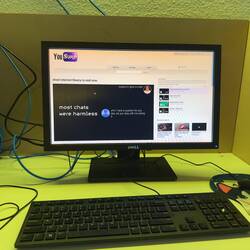 An installation set up like an internet cafe with a series of videos from You Surp.