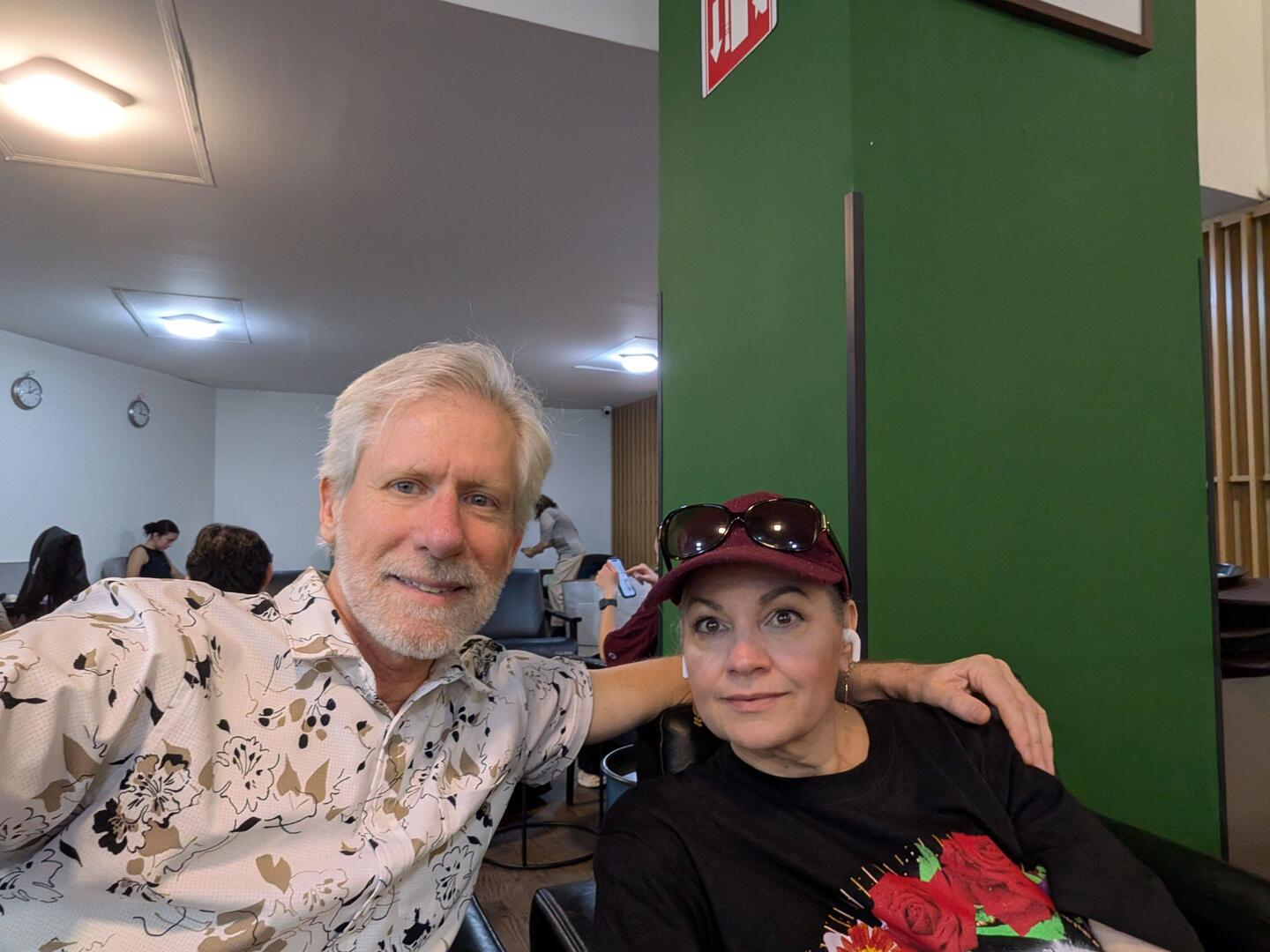 We are smiling. Little did we know our flight would later be cancelled. ☹️