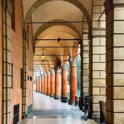 Portico overlooking Piazza Santo Stefano — Bologna, Italy.