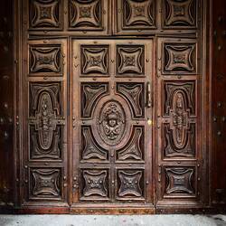 A beautiful door-within-a-door — Bologna, Italy.