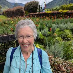 Marcia and a beautiful red flower