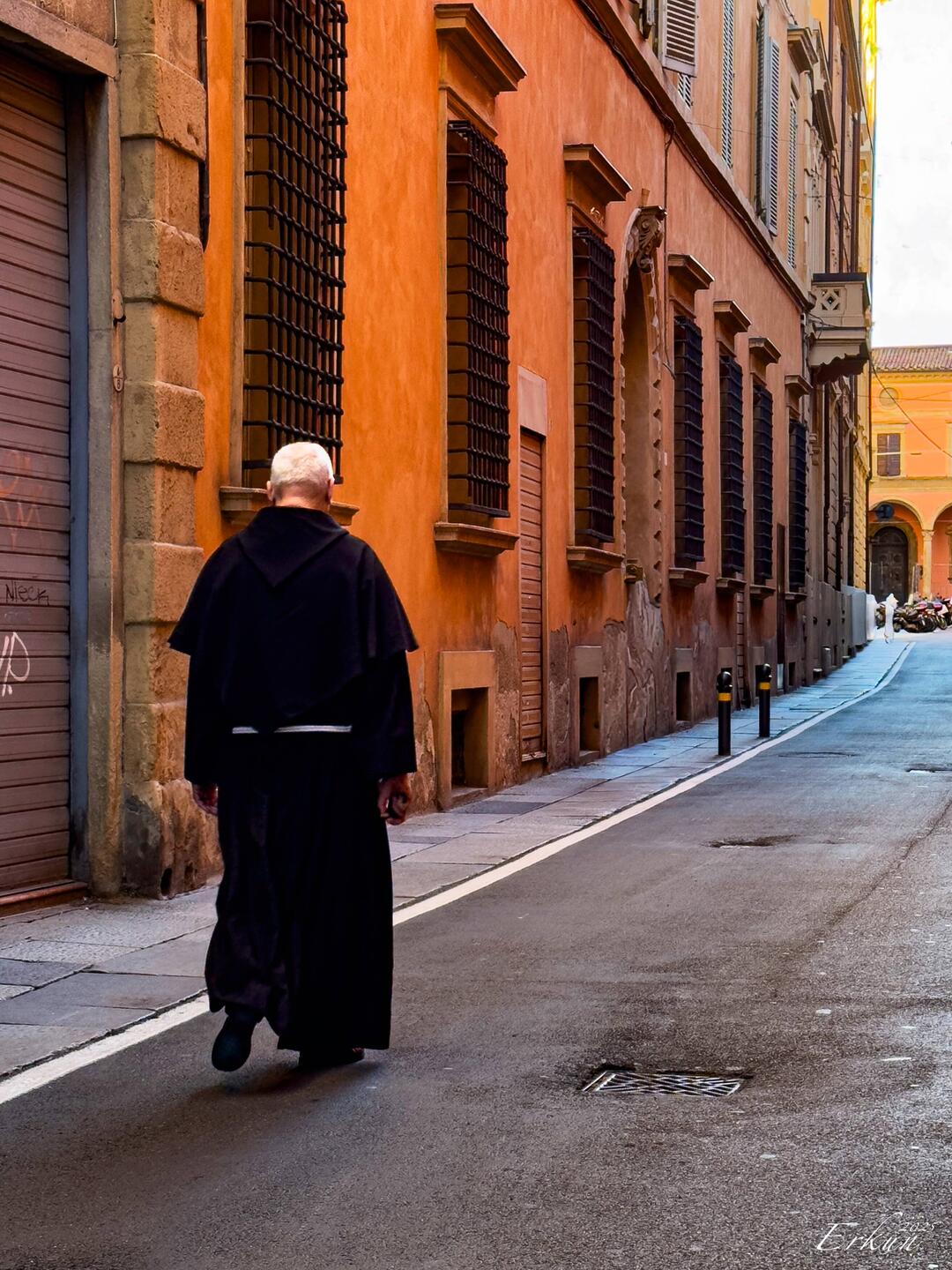 You know you're in Italy when you see a padre strolling down a street — Bologna, Italy.