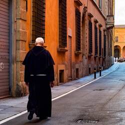You know you're in Italy when you see a padre strolling down a street — Bologna, Italy.