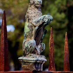 The fence surrounding Basilica di San Francesco is decorated with lion statuettes — Bologna, Italy.