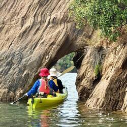 Hannah and Cyndee navigate a tunnel