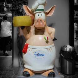 At the entrance to a Mortadella and cheese shop — Bologna, Italy.