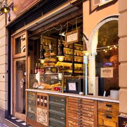 The to-go orders are placed at this window ... La Prosciutteria — Bologna, Italy.