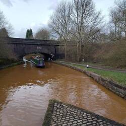 Cruising under Poole Aqueduct that carries the Macclesfield over the Trent and Mersey