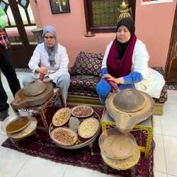 Grinding argan for oil. Roasted argan oil (left) is for eating. Natural on the right is for beauty.