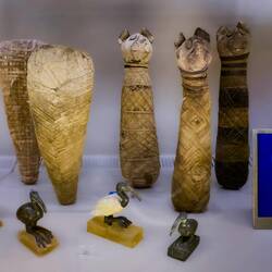 Mummies and statuettes of ibis (L) and cat mummies — Museo Civico Archeologico di Bologna.