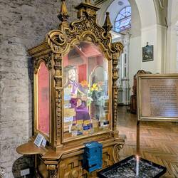 They put Jesus in one of those fortune telling boxes inside the church. This was new to me.