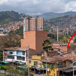 The gondola system goes from the station, up & over the hill and down the other side