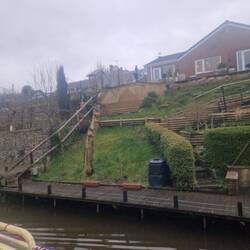 Carved woodpecker on an old tree stump