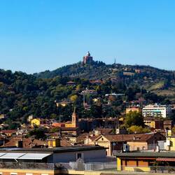 San Luca atop a distant hill — Palazzo d'Accursio.