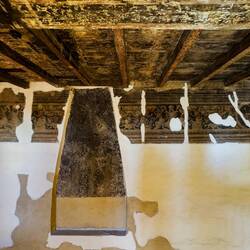 Fragments of the frescoes that once decorated the tower walls — Palazzo d'Accursio.