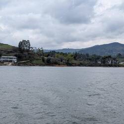 Pablo Escobar's club (L) and bombed house (R). The govt took the house when he died.
