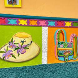 A delightful zocalo outside a hat shop