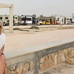 Campers of surfers lined up along the promenade
