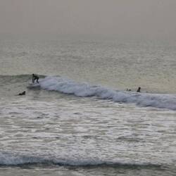 Wave surfers on the Atlantic side