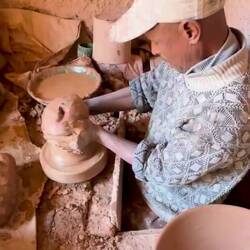 The pottery wheel is ground level. He sits underground!😮