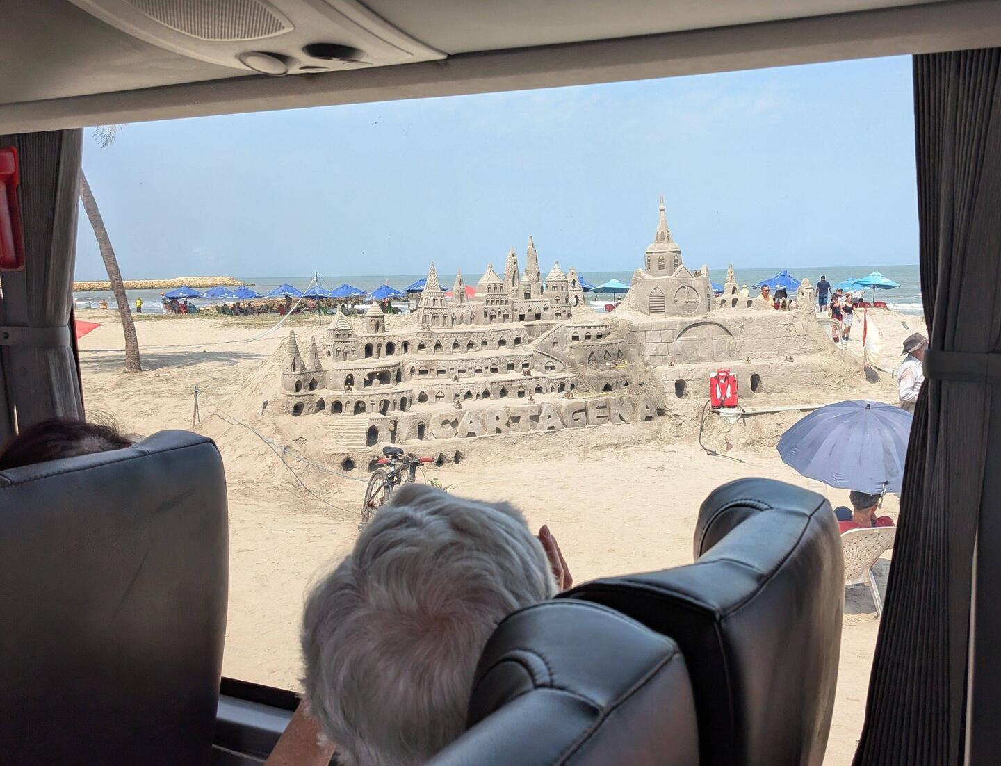 A sandcastle by a professional builder. There's a tip jar out front.