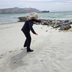 Trying to stand straight against the wind.