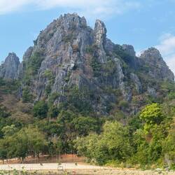 Karst formations made rocky gargoyle faces at us as we cycled past.